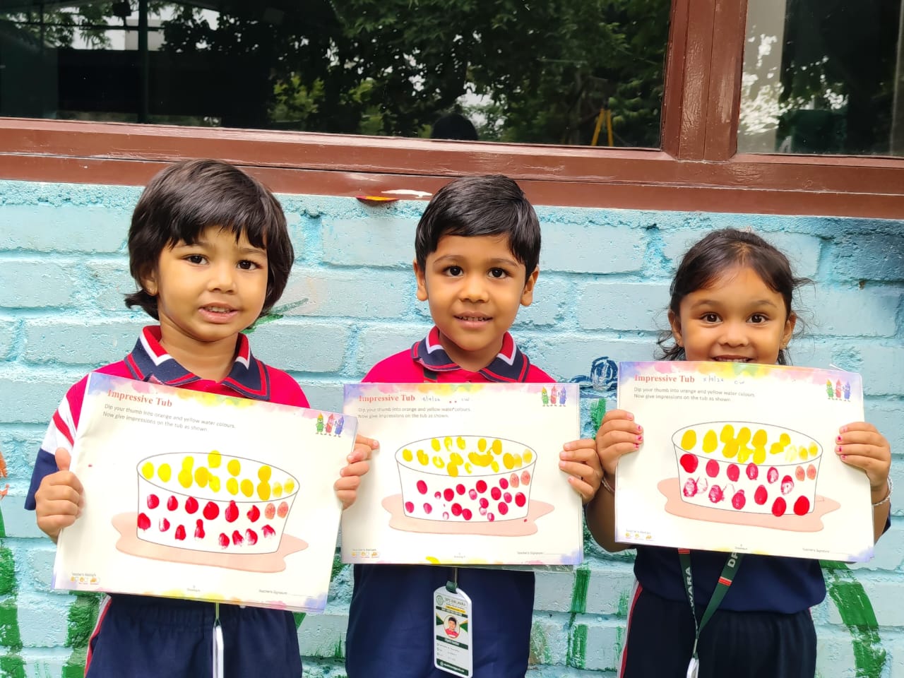 Students displaying their impressive tub artwork