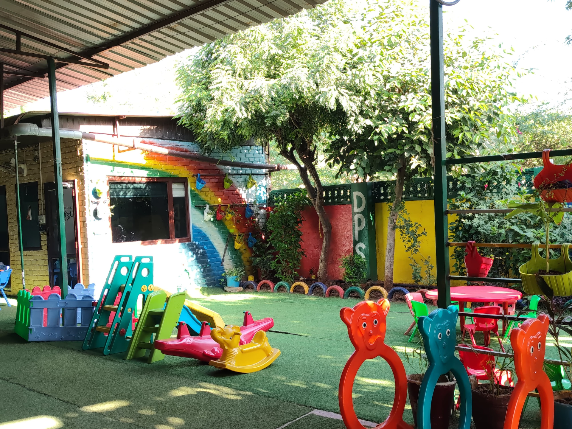 Junior Wing play area with slides and rocking toys at DPS Bhilwara