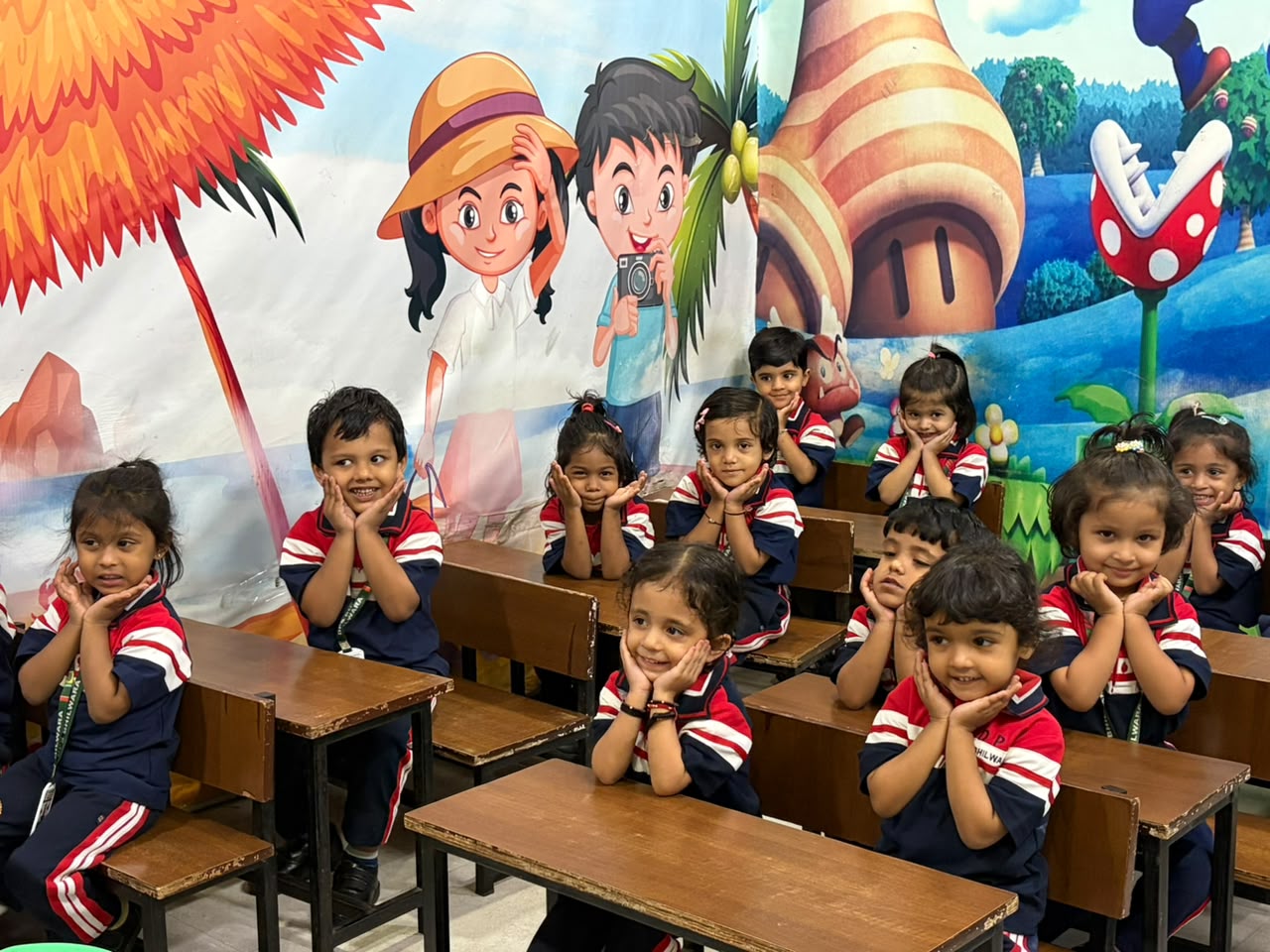 Smiling Junior Wing students posing in a colourful classroom