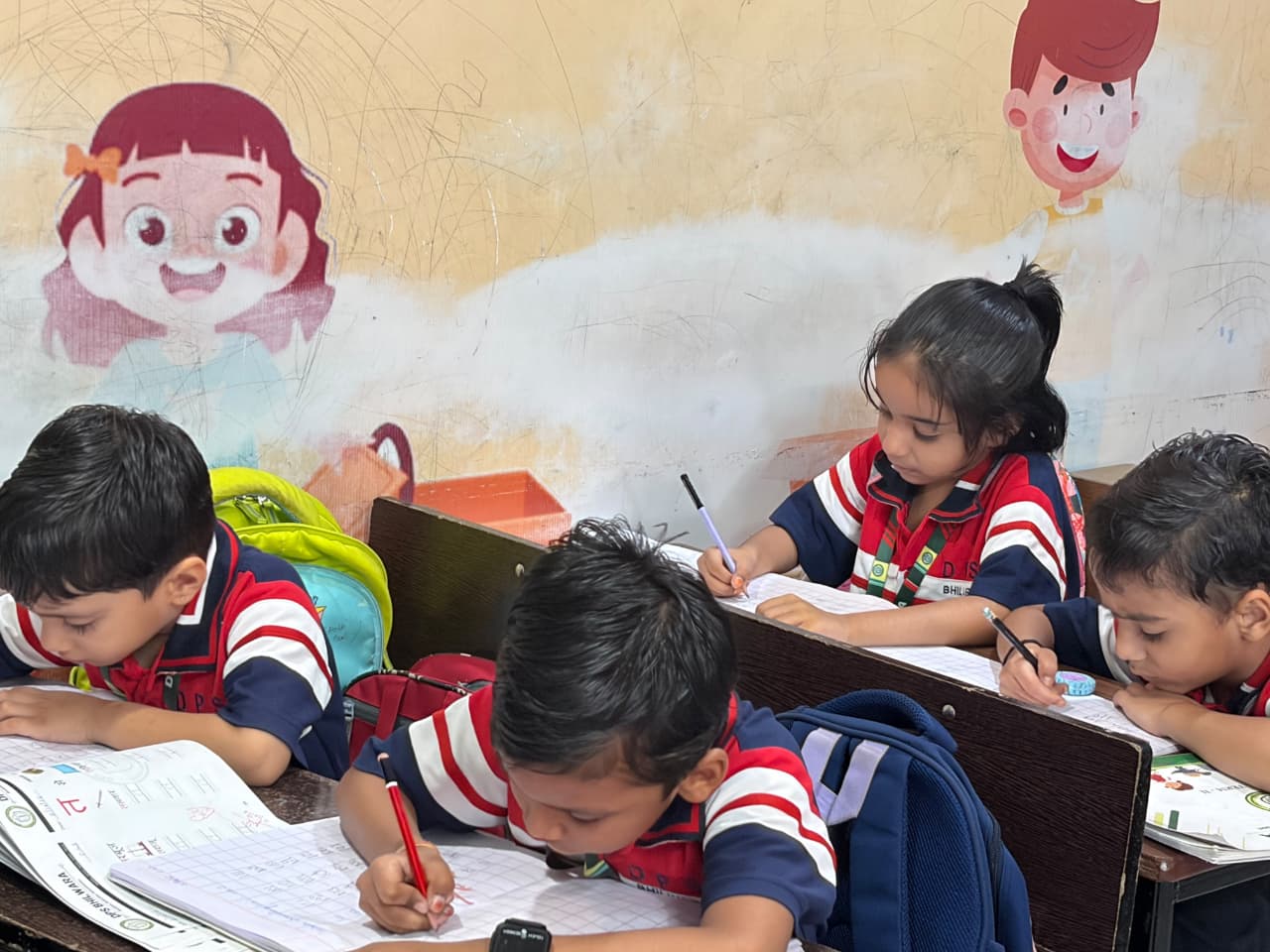 Students doing writing practice at their desks