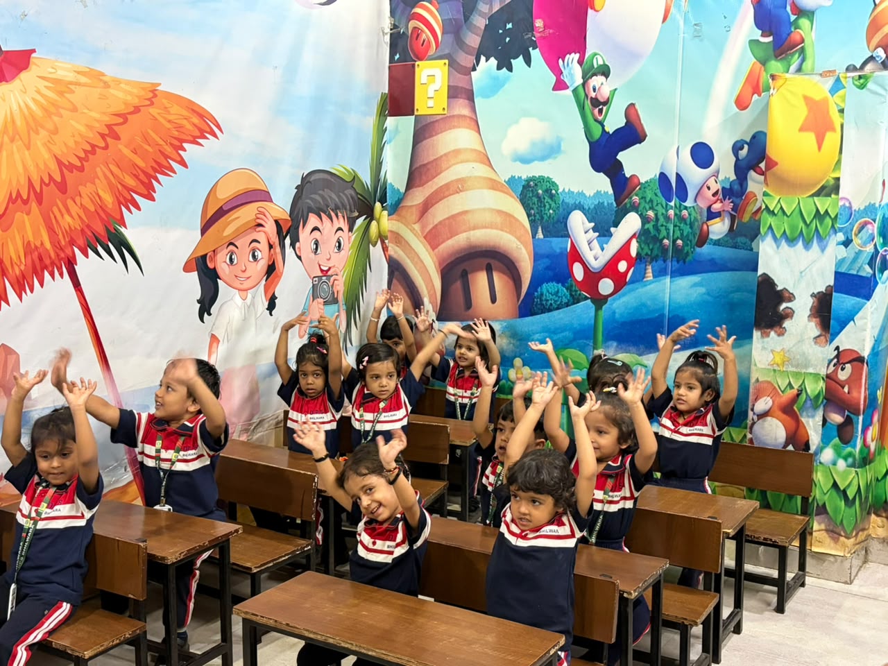 Junior Wing students raising hands during a classroom activity