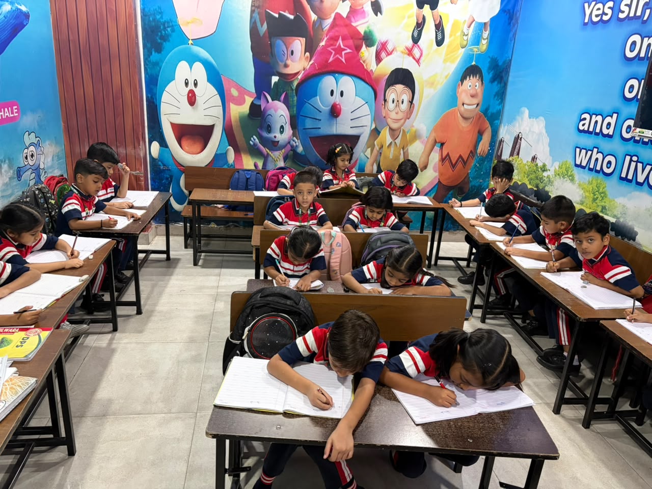 Junior Wing students focused on writing practice in class